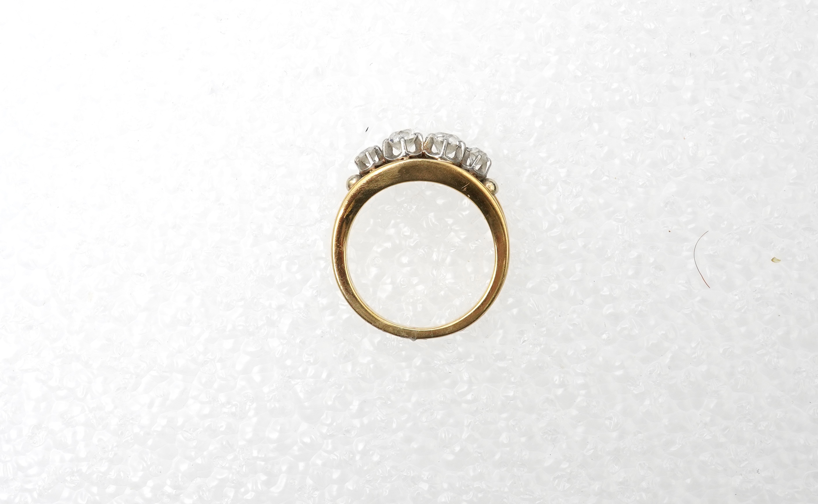 A four-stone diamond ring, mid 20th century